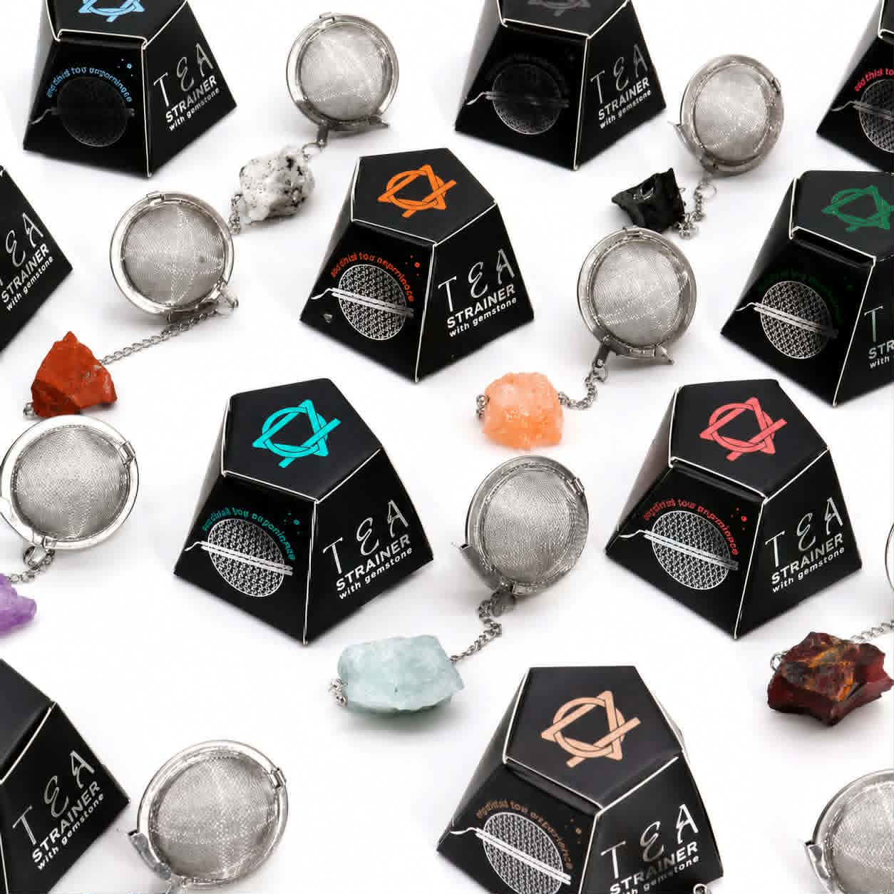 Collection of raw gemstone tea strainers featuring natural crystals with stainless steel loose leaf tea infusers. 