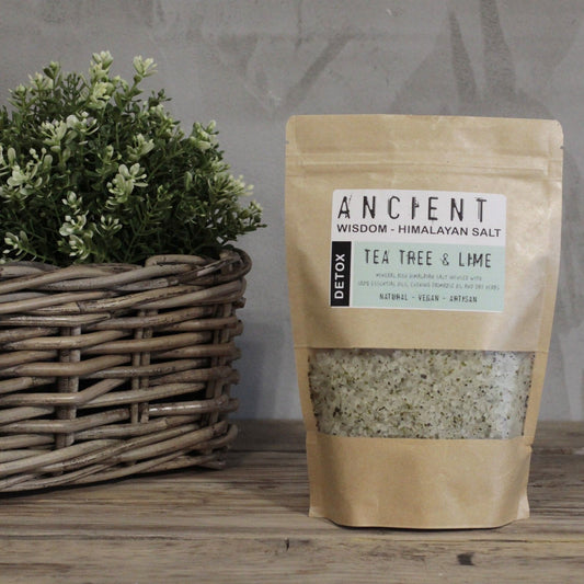 Resealable paper bag of Himalayan bath salts infused with Tea Tree and Lime essential oils, Evening Primrose Oil and botanical herbs