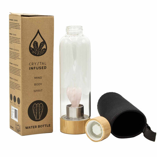 Glass water bottle with bamboo base and lid, containing rose quartz angel