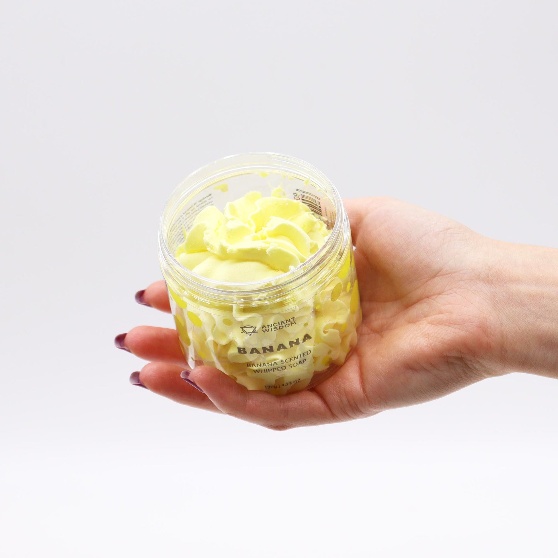 Banana whipped soap with sweet creamy banana fragrance and soft whipped texture in a clear jar