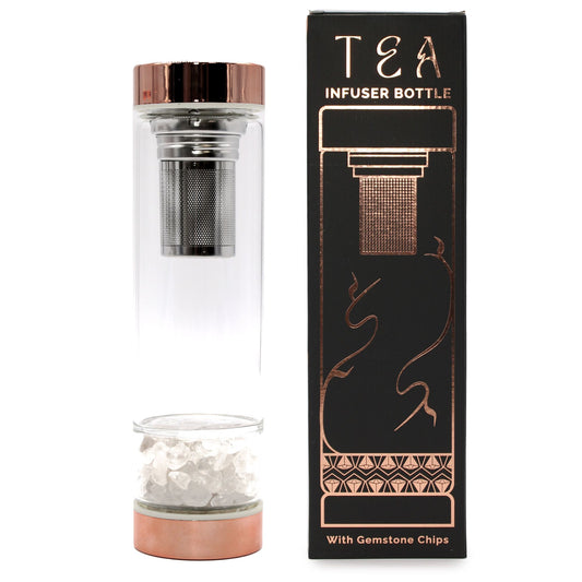 Glass tea infuser bottle with rose gold accents and rock quartz crystal chamber.