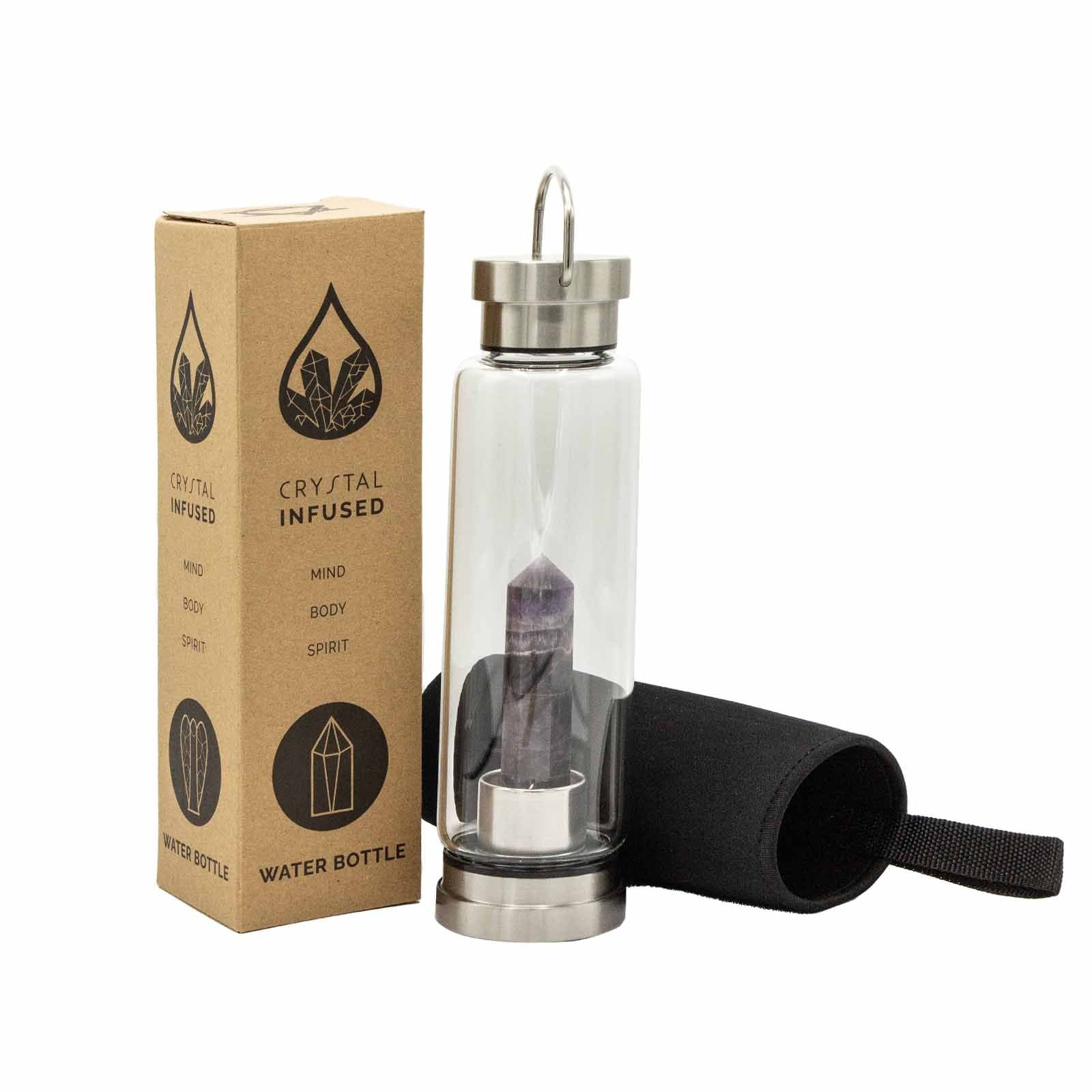 Glass water bottle with stainless steel base, lid and handle, containing amethyst obelisk