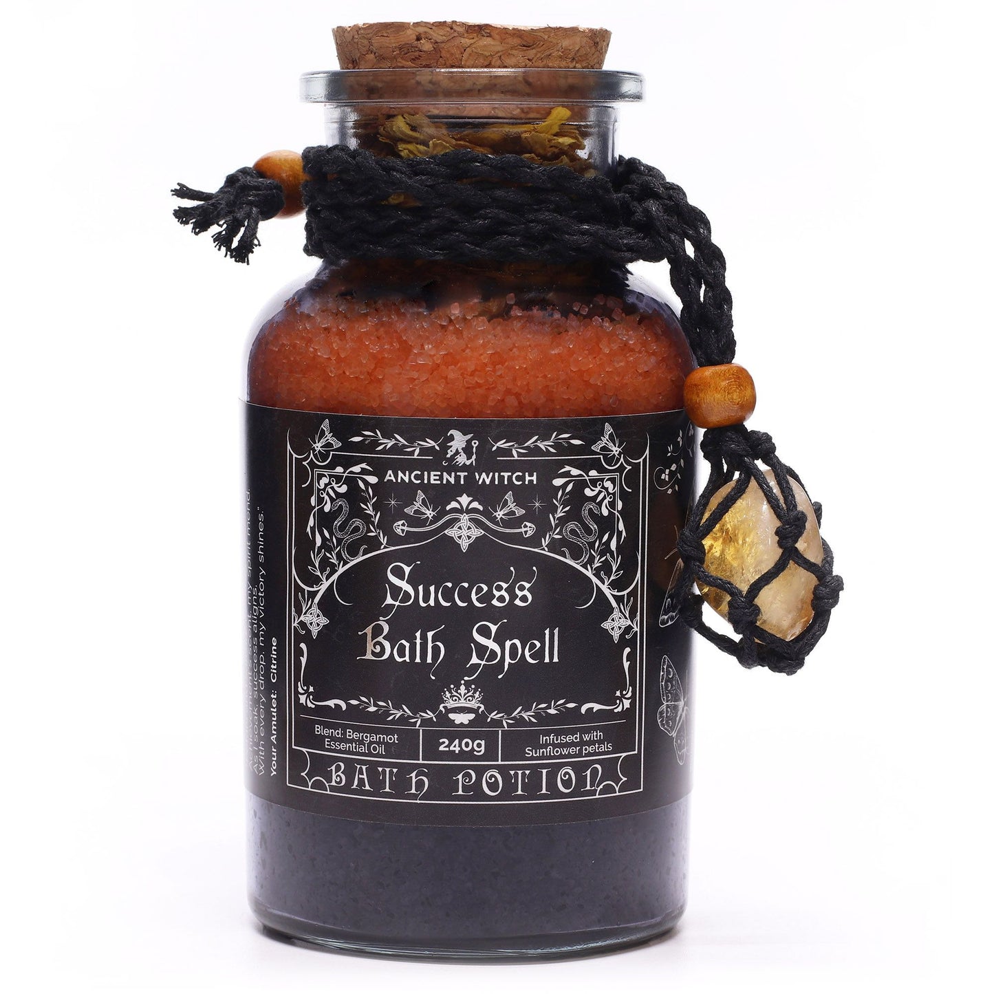 Glass bottle with cork lid filled with Himalayan bath salts, sunflower petals and Bergamot essential oil with a Citrine crystal amulet