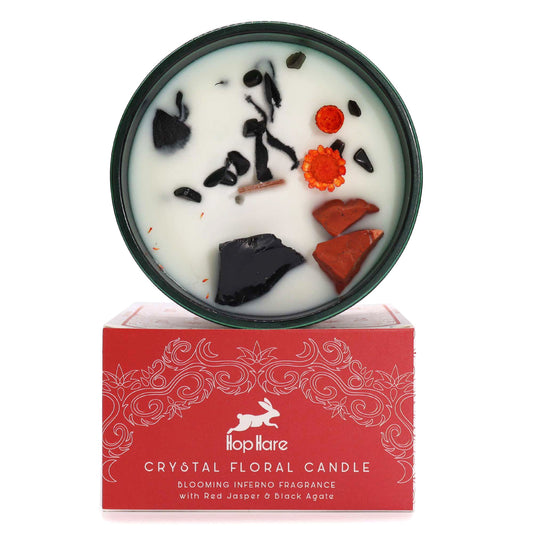 Soy wax candle with red jasper and black agate crystals, dried flowers, wooden wick in dark green jars.