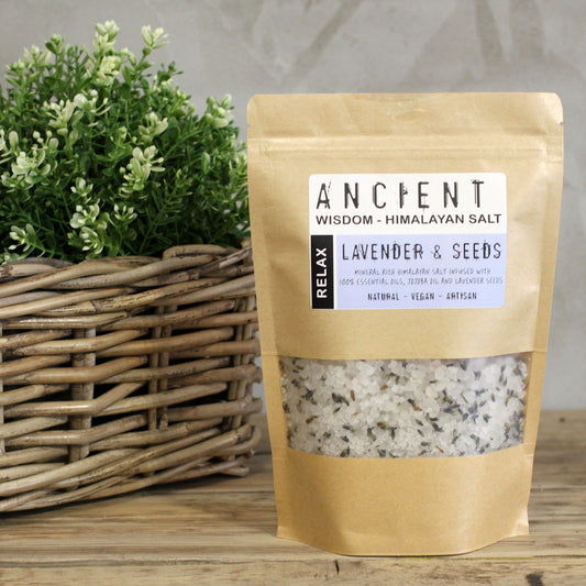 Resealable paper bag of Himalayan bath salts infused with Lavender essential oil, Jojoba Oil and dried Lavender flowers